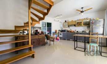 Imagem 4: Living em dois ambientes com cozinha americana, lavabo, pátio, lavanderia. o3 dormitórios