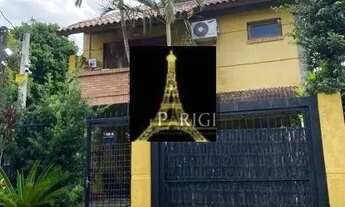 Imagem 2: Casa com 3 dormitórios para alugar, 154 m² por R$ 5.065,00/mês - Guarujá - Porto Alegre/RS