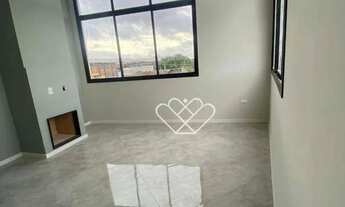 Imagem 3: Luxo e Conforto: Apartamento com Pé Direito Duplo, Lareira e Box no Edifício Valentina