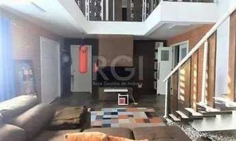 Imagem 2: Casa com 233m², 2 dormitórios sendo 1 suíte, living com lareira, espaço gourmet com churra