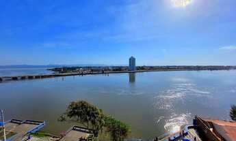 Imagem 4: Na beira do rio em Tramandaí, apartamento com quatro quartos, mobiliado, com uma linda vi