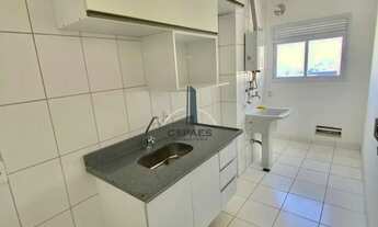 Imagem 4: Cond. Essencialle Home Club, sala ampliada, cozinha americana com armários, 2 vagas, andar