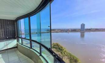 Imagem 2: Na beira do rio em Tramandaí, apartamento com quatro quartos, mobiliado, com uma linda vi