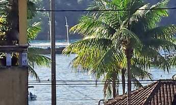 Imagem: Casa com piscina e área gourmet vista ao