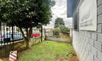 Imagem 4: UM TERRENO COM UMA CASA SIMPLES