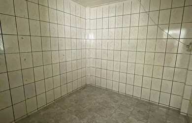 Imagem 6: Casa em frente à praça camerindo