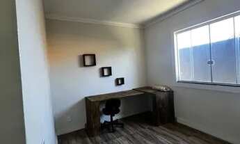 Imagem 4: Casa com quintal e área de churrasqueira