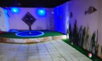 Imagem 2: Casa com espaço gourmet completo, piscina e garagem para 5 carros