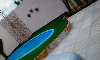 Imagem 4: Casa com espaço gourmet completo, piscina e garagem para 5 carros