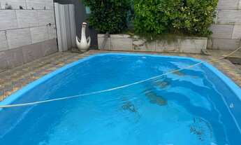 Imagem 2: Casa Linear com piscina em cosmos