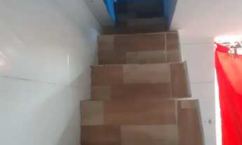 Imagem 7: Vendo uma casa com um prédio no fundo