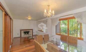 Imagem 3: Casa com 322m², 3 quartos, 3 suítes, 4 vagas, no bairro Três Figueiras em Porto Alegre