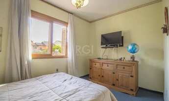 Imagem 6: Casa de 103m² - 3 dormitórios, 1 suíte, churrasqueira, pátio e 2 vagas de garagem no bairr