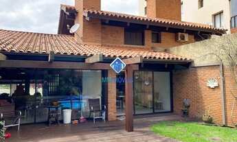 Imagem 2: Casa com 410m² distribuídos em 06 dormitórios sendo 03 suítes, 02 vagas, no bairro Praia G