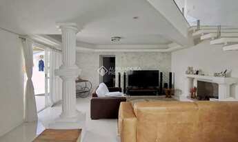 Imagem 4: Casa 4 dormitórios para alugar em Florianópolis - 3 suítes, 5 vagas, piscina e vista deslu