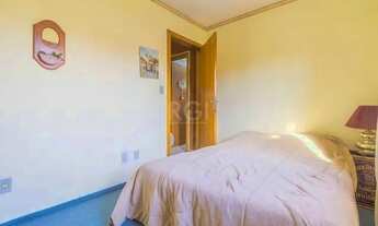 Imagem 7: Casa de 103m² - 3 dormitórios, 1 suíte, churrasqueira, pátio e 2 vagas de garagem no bairr