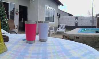 Imagem 6: Casa com piscina e garagem coberta