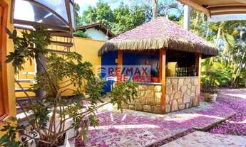 Imagem 5: A casa amarela com jardim rosa. Uma linda casa em condomínio tranquilo