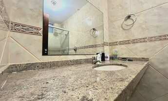 Imagem 5: Com 03 suítes, varanda, sala ampla e lavabo, este imóvel oferece um ambiente aconchegante