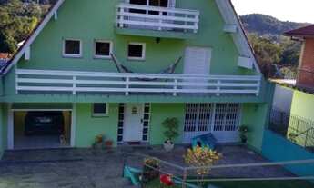 Imagem: Casa estilo cabana. Bairro Logradouro, Nova