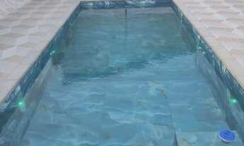 Imagem: Área de piscina com churrasqueira