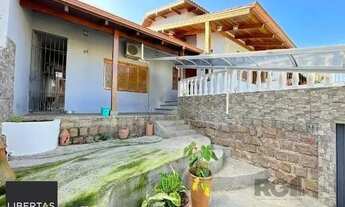 Imagem 4: Sobrado em Porto Alegre, no bairro Vila Nova, com 3 dormitório(s), e 3 banheiros