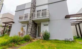 Imagem 2: Casa em condomínio 3 dormitórios com 2 vagas de garagem à venda no bairro Lomba do Pinheir