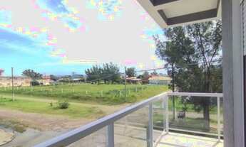 Imagem 5: SOBRADO PRÓXIMO AO MAR E A PLATAFORMA DE PESCA, EM TRAMANDAÍ