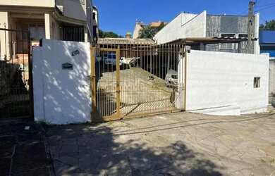 Imagem: Terreno de 392m² com casa mista de 82m²