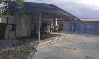 Imagem: Amplo terreno com casa, fronte à rodovia