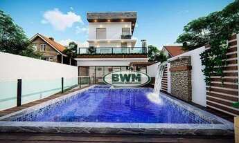 Imagem: Casa com três dormitórios sendo três