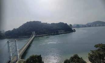 Imagem: Sala Living Frente Mar Vista p/ a Ponte