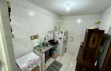 Imagem 7: Apartamento térreo 2 Dormitórios, Sala ampla dois ambientes, Cozinha, 1 Banheiro, 1 Vaga