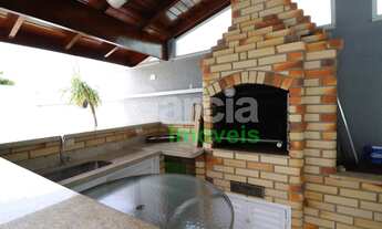 Imagem 4: Sobrado com piscina perto da praia com 4 dormitórios