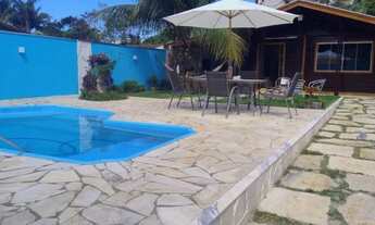 Imagem 3: Casa Temporada Caraguá em Massaguaçu 3 quartos sendo uma suíte. Piscina e churrasqueira