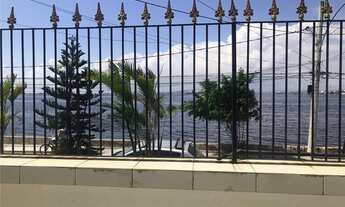 Imagem 3: Casa charmosa e aconchegante para locação. Sala, 2 quartos sendo uma suíte e closet, varan