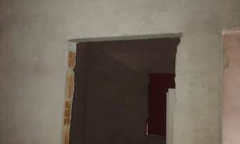 Imagem 2: Um terreno com uma casa com documento frente para a pista 12 de largura e 41 complimento