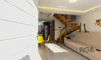 Imagem 2: Casa em condomínio, possui 2 dormitórios, sala para 2 ambientes e 1 vaga