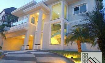 Imagem 1: CASA EM CONDOMÍNIO 4 DORMITÓRIOS (440m²), 4 SUITES, SEMI MOBILIADA, 8 VAGAS DE GARAGEM