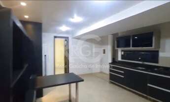 Imagem 5: Casa com dois andares no bairro São João em Porto Alegre/RS, possuindo ambientes bem dispo