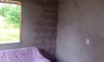 Imagem 4: Um terreno com uma casa com documento frente para a pista 12 de largura e 41 complimento