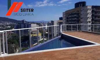 Imagem 3: Apartamento de 2 dormitórios com suite semi mobiliado e sacada com churrasqueira