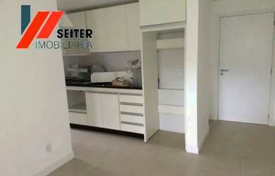 Imagem 2: Apartamento de 2 dormitórios com suite semi mobiliado e sacada com churrasqueira