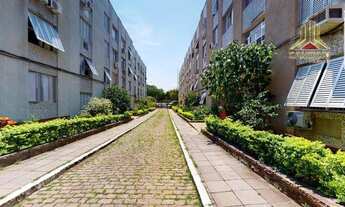 Imagem 7: Na Rua Eurico Lara em Porto Alegre, vendo apartamento de dois dormitórios com garagem