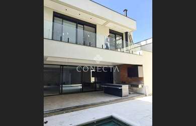 Imagem 3: Casa com acabamento de alto padrão 5 suítes Área gourmet com churrasqueira e piscina