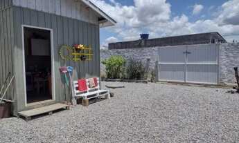 Imagem 4: Troco terreno, com casa de madeira na Palhoça