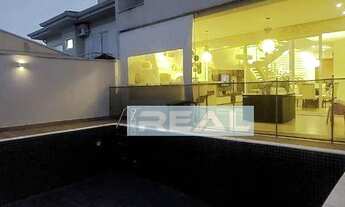 Imagem 5: Extraordinária casa no Portal dos Ipes - Lago de carpas na sala e 3 Suítes