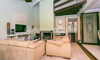 Imagem 2: Casa de condomínio à venda de 295m² com 3 suítes no bairro Agronomia em Porto Alegre