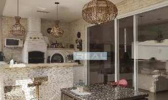 Imagem 6: Extraordinária casa no Portal dos Ipes - Lago de carpas na sala e 3 Suítes