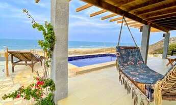 Imagem: Casas a Beira Mar, pé na areia na praia